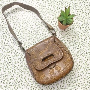 Vintage tooled leather saddle bag